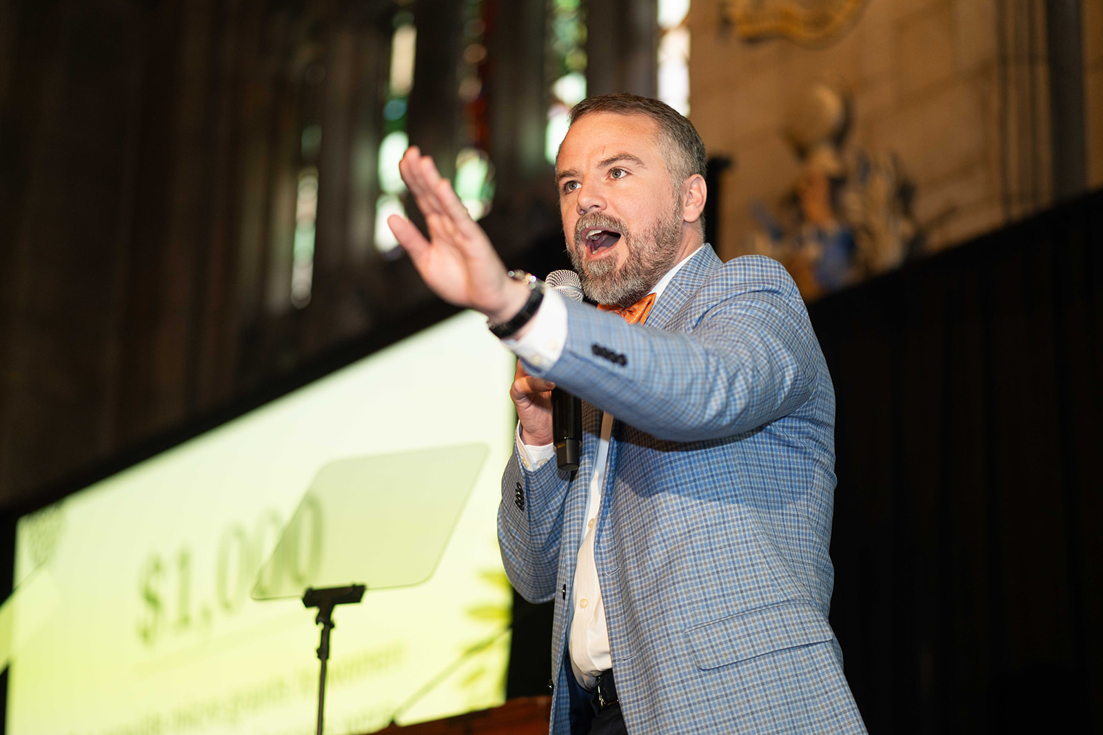 A man speaking with a mic