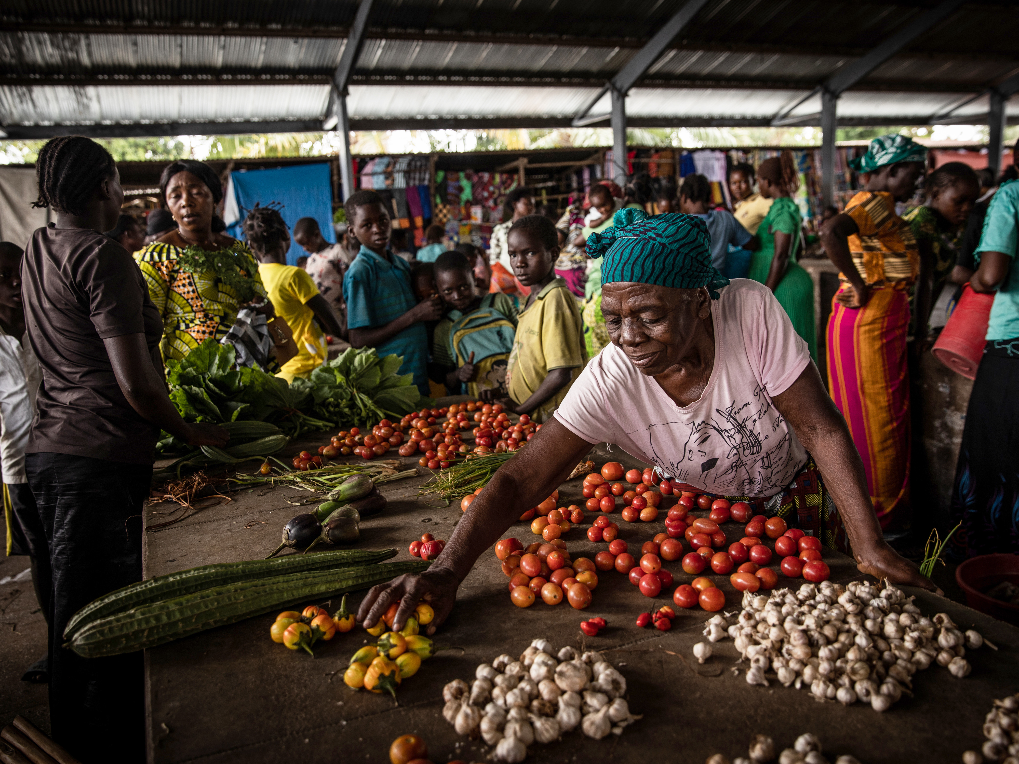 Francoise Kakuji, 70, displays her vegetables for sale at the central market of the town of Manono, Tanganyika Province, DRC. Products grown on rural farmland as part of Concern Worldwide’s Food for Peace program are often destined to be transported to, and sold at this market.