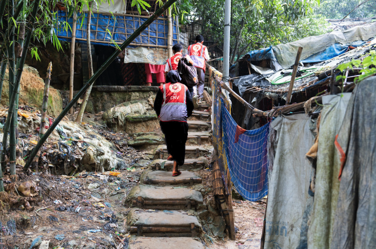 Community Nutrition Volunteers navigate the steep, hilly terrain of the Rohingya camps surrounding Cox's Bazar. During monsoon season, they also have to navigate floodwaters and potential landslides. Despite these risks, Concern has maintained continuous coverage even through natural disasters with emergency preparedness and coordination.