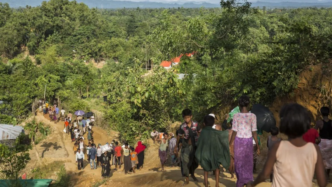 Rohingya refugees at Cox’s Bazar, Bangladesh in 2017. Myanmar is less than two miles away, visible in the distance. (Photo: Kieran McConville)