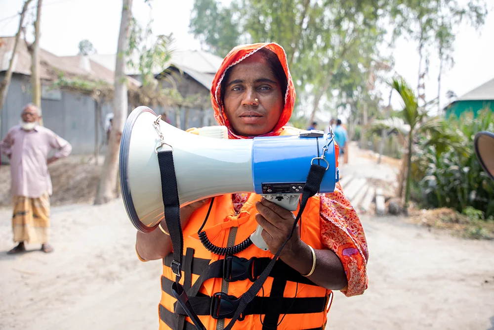 A member of an emergency warning group in Bangladesh with a bullhorm