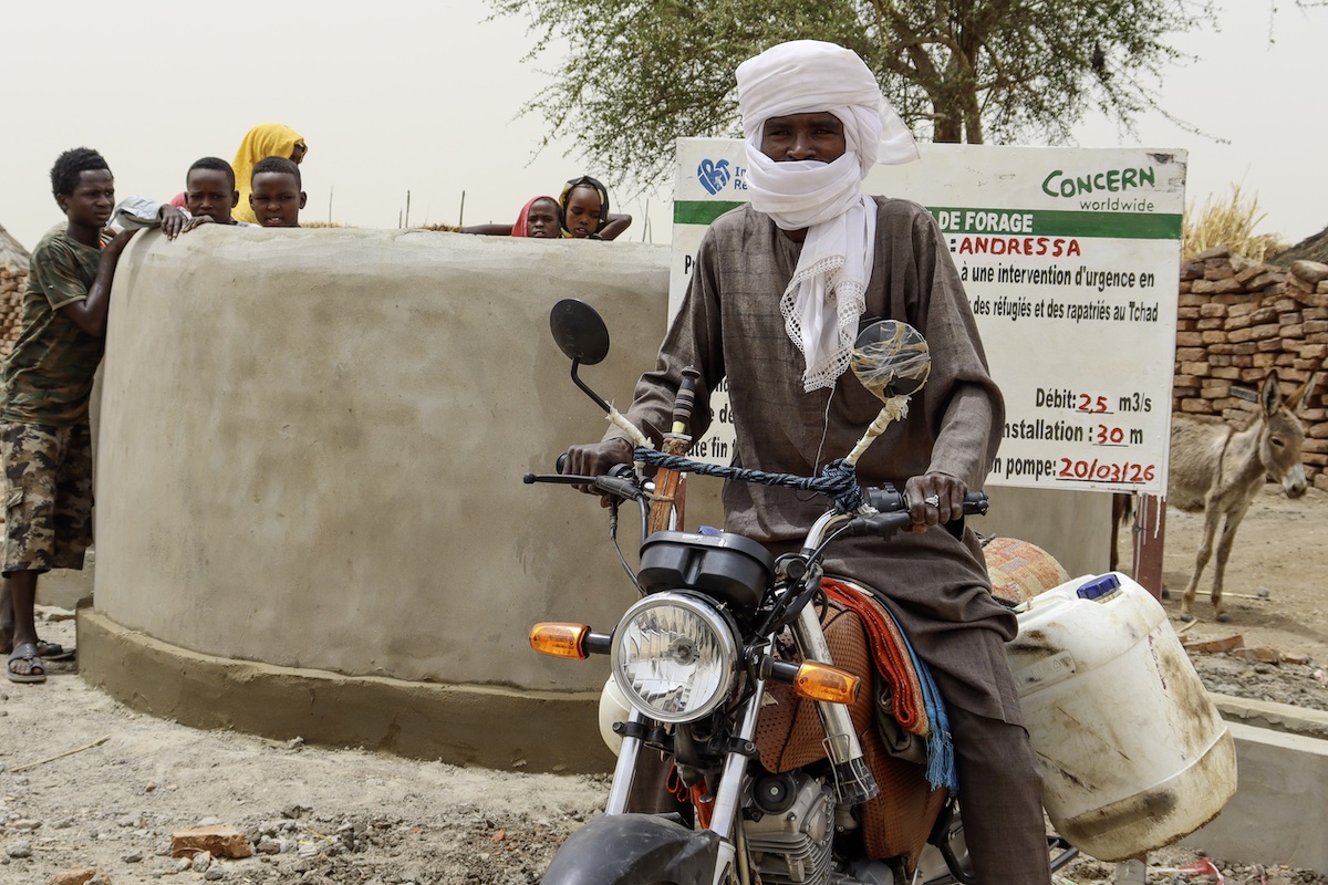 Moustapha Ahmat Youssouf collects water at an IRT water point in Andressa, Chad.