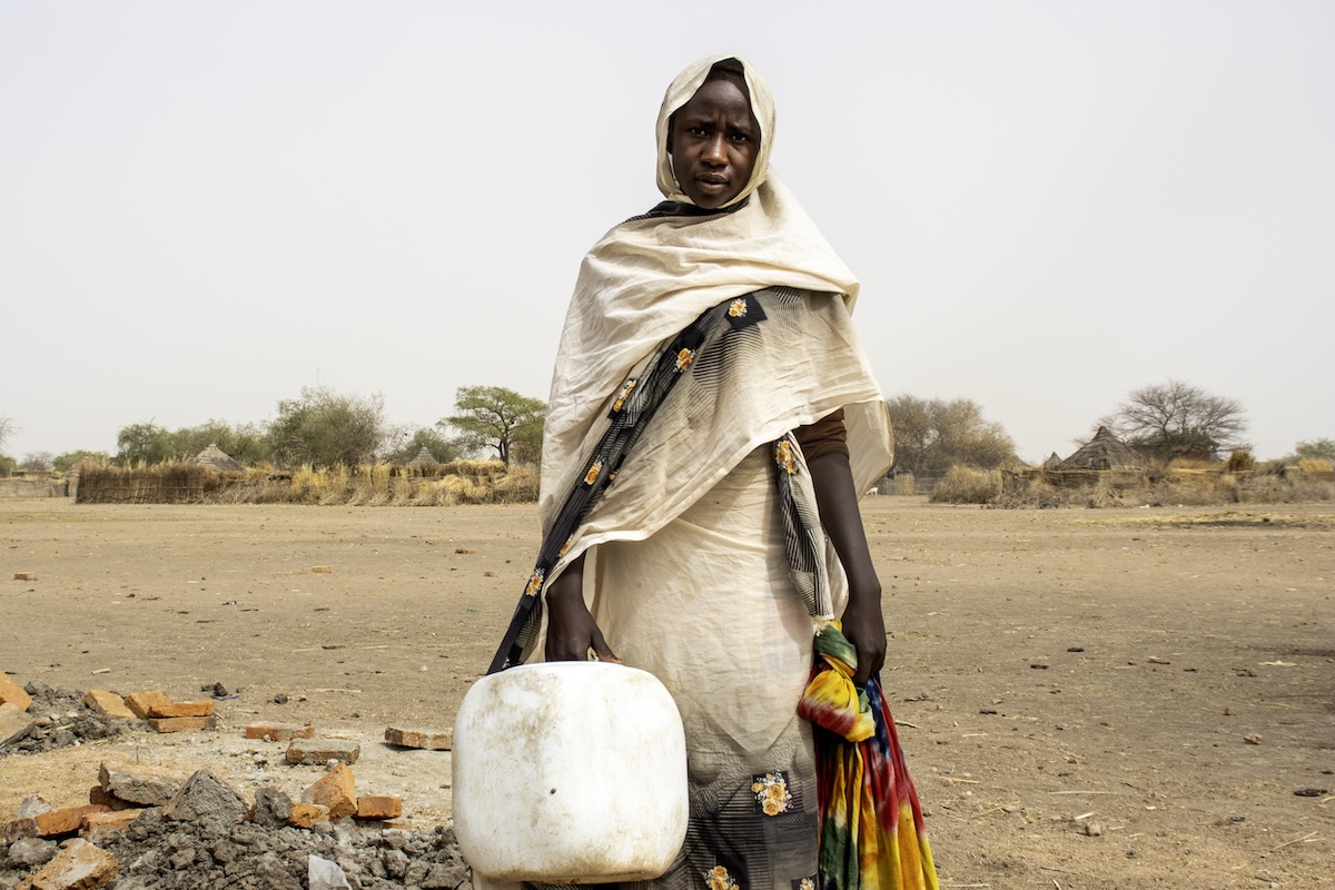 Mariam Achim from Mogororo village on her way to collect water. (Photo: Saam Kouakaine/Concern Worldwide)