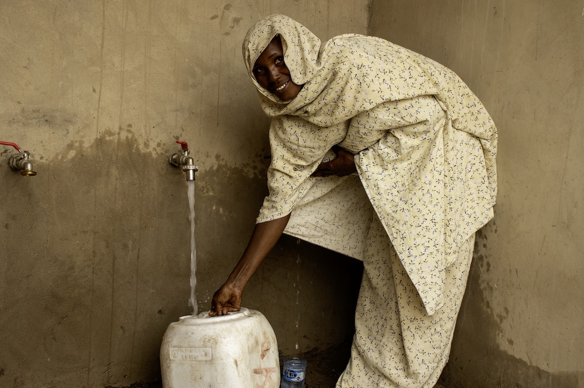 Rahiya collects water from a water point installed by Concern with support from IRT in her home village in Chad.