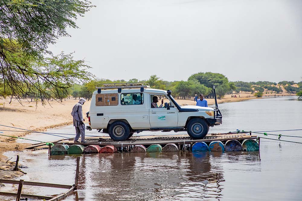 A mobile health clinic truck traverses the tributaries of the Lake Chad region