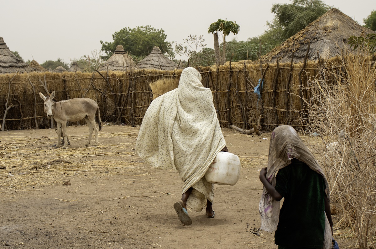 Rahiya Ahmat Issakha collects water at a community water point build by Concern with support from International Relief Teams. (Photo: Saam Kouakaine/Concern Worldwide)