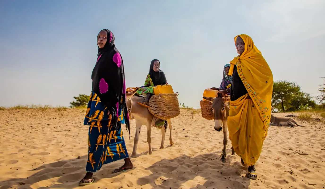 Women traveling to find water