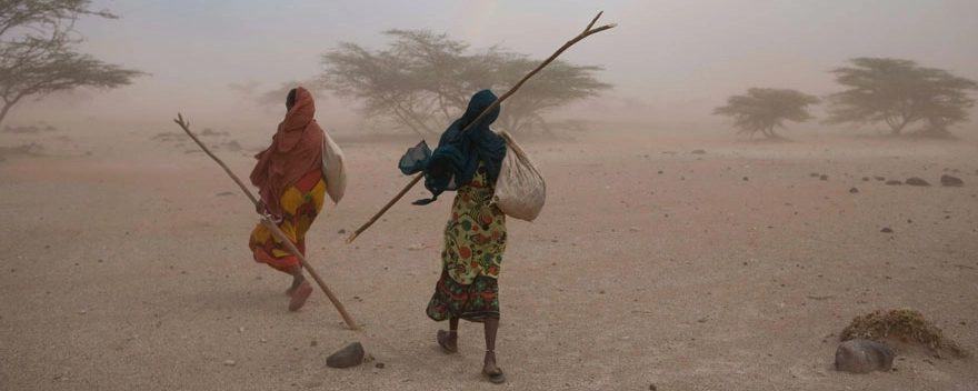 Two women in a desert-like environment