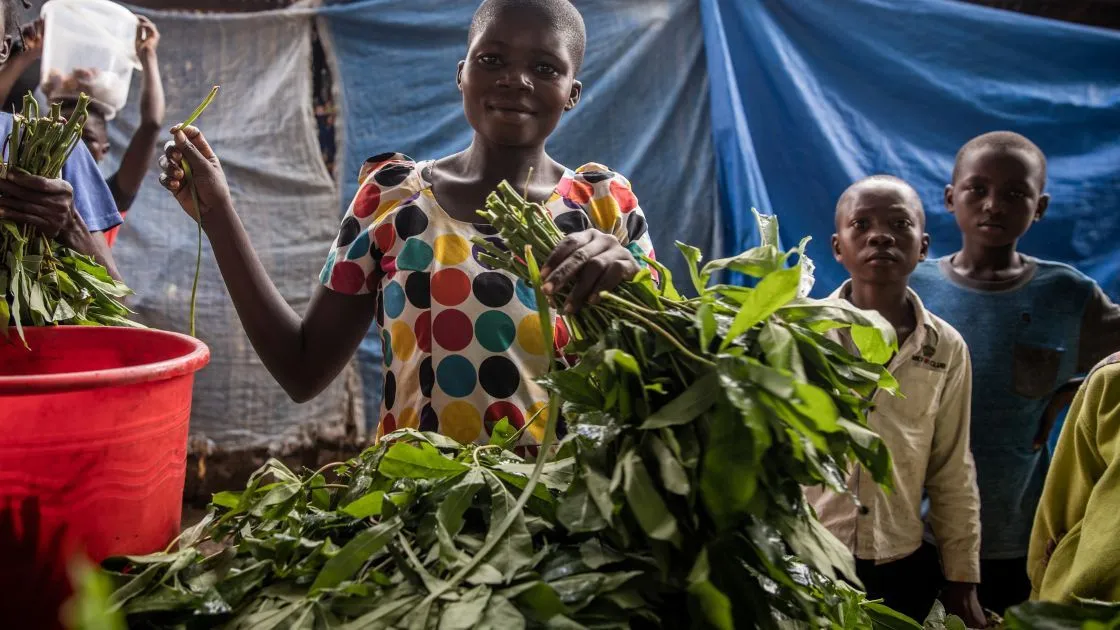 Ruth Ngoyi and her vegetables for sale at the central market of the town of Manono, Tanganyika Province, DRC