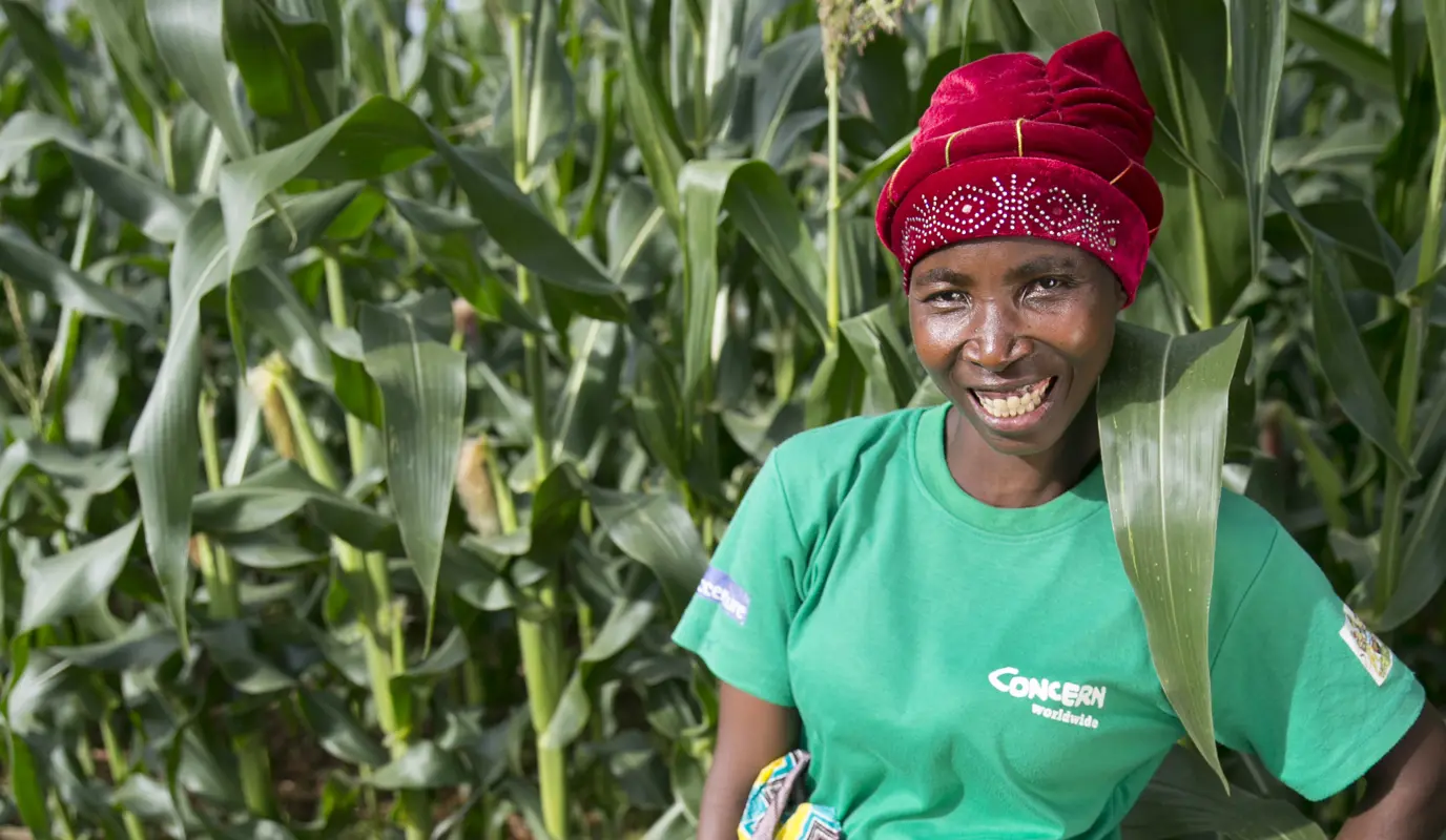 Lead conservation agriculture farmer Esime with her crops in Malawi.