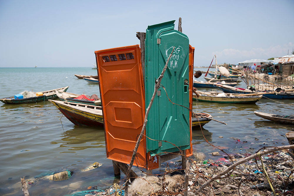 An improvised latrine on the water's edge in Cite Soleil, Port au Prince, Haiti