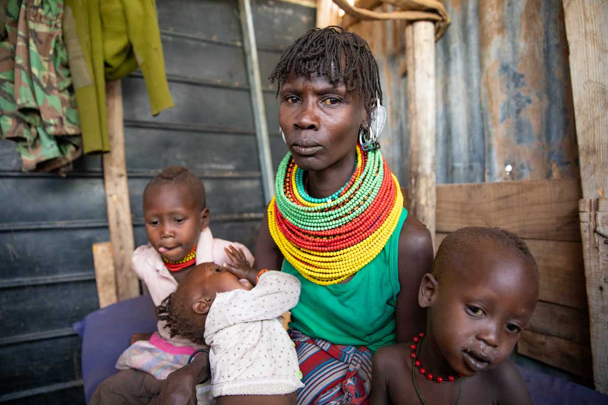 Pulling the material of her shirt around her stomach, Akiru Leakinoi explains how she tries to prevent the feeling of hunger: “I just tighten my clothes like this until the evening when I might get some milk. Once I went for a full day without any food. I woke up the following day and I couldn’t get up.