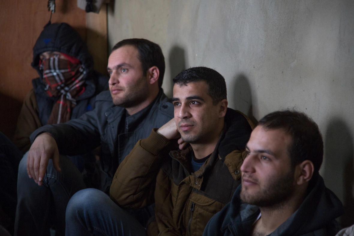 Syrian refugees listening to a Concern Protection Field Officer