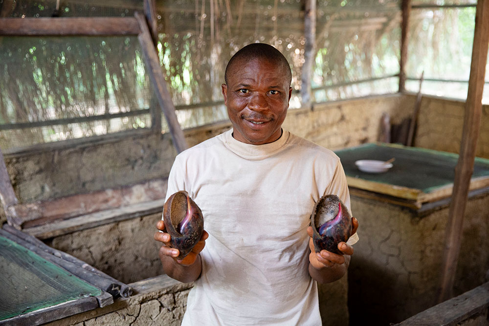 Man with snails in Liberia