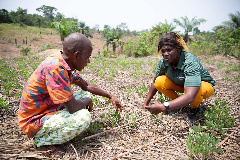 Concern Worldwide staff member with farmer in Liberia