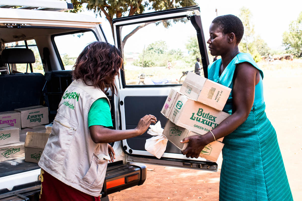 Concern employee Judith Cent distributing soap to the Health Surveillance Assistants (HSAs) and Community Health Volunteers (CHVs) to distribute among the community. (Photo: Concern Worldwide)