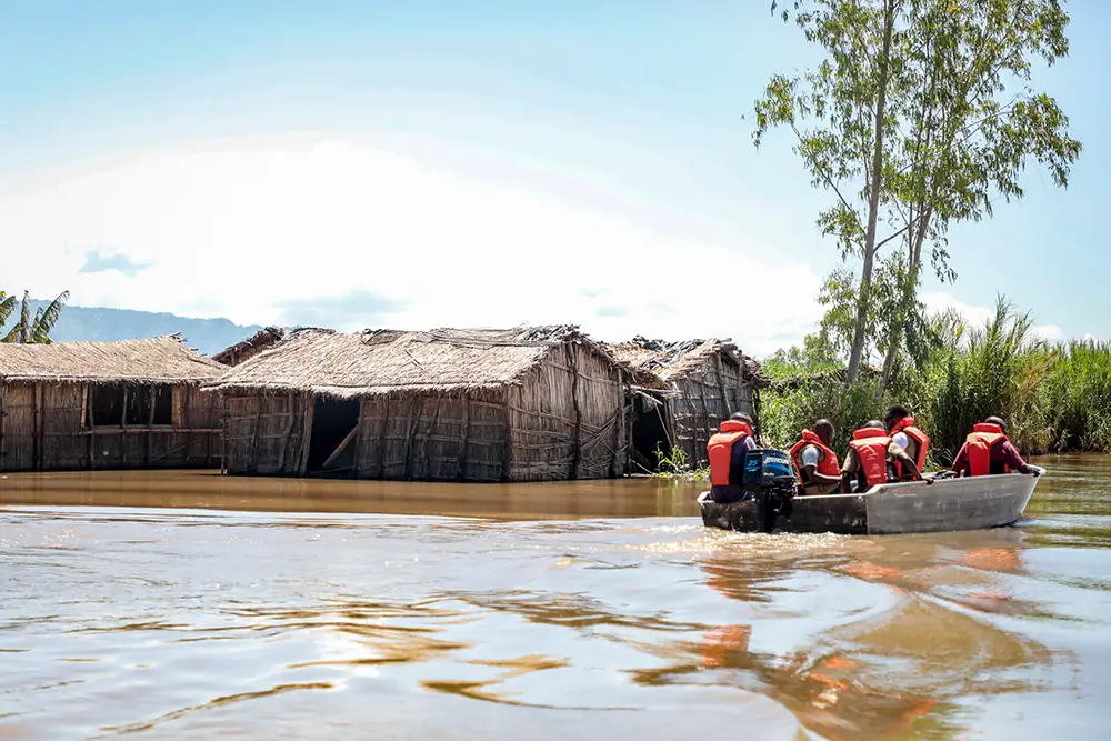 Aid workers deliver supplies to a flood affected community in Malawi