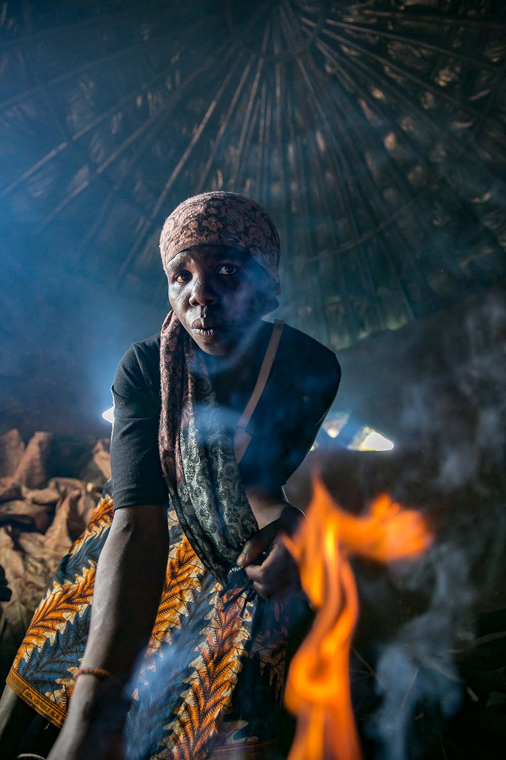 A woman by a cooking fire in Malawi