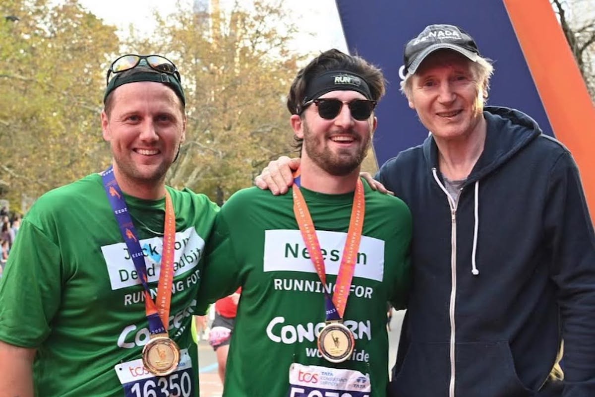 2023 New York City Marathon runners and Team Concern members Jack McGarry and Daniel Neeson, pictured at the finish line with Daniel's father, Liam Neeson.