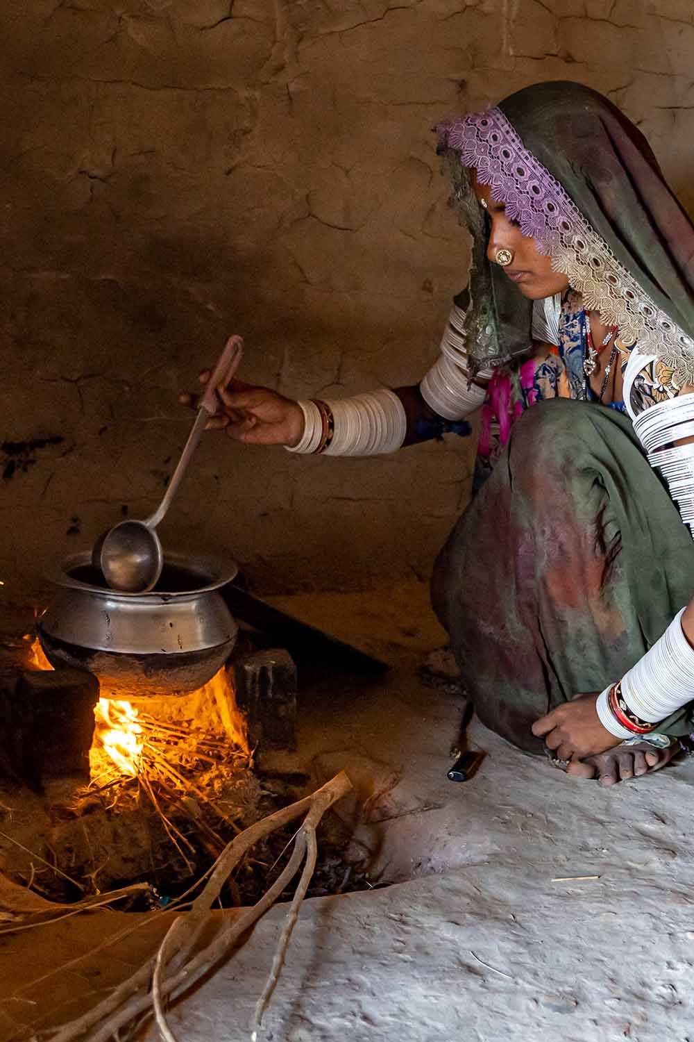 A woman cooking over a fire in Pakistan