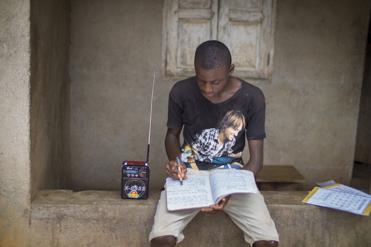 Mada Karimu (15) is a form 3 student at the Baptist Secondary School in Magburaka, Sierra Leone. During the Ebola outbreak, the school was clsoed. Mada and many of his fellow classmates follower lessons every day through special radio broadcasts.