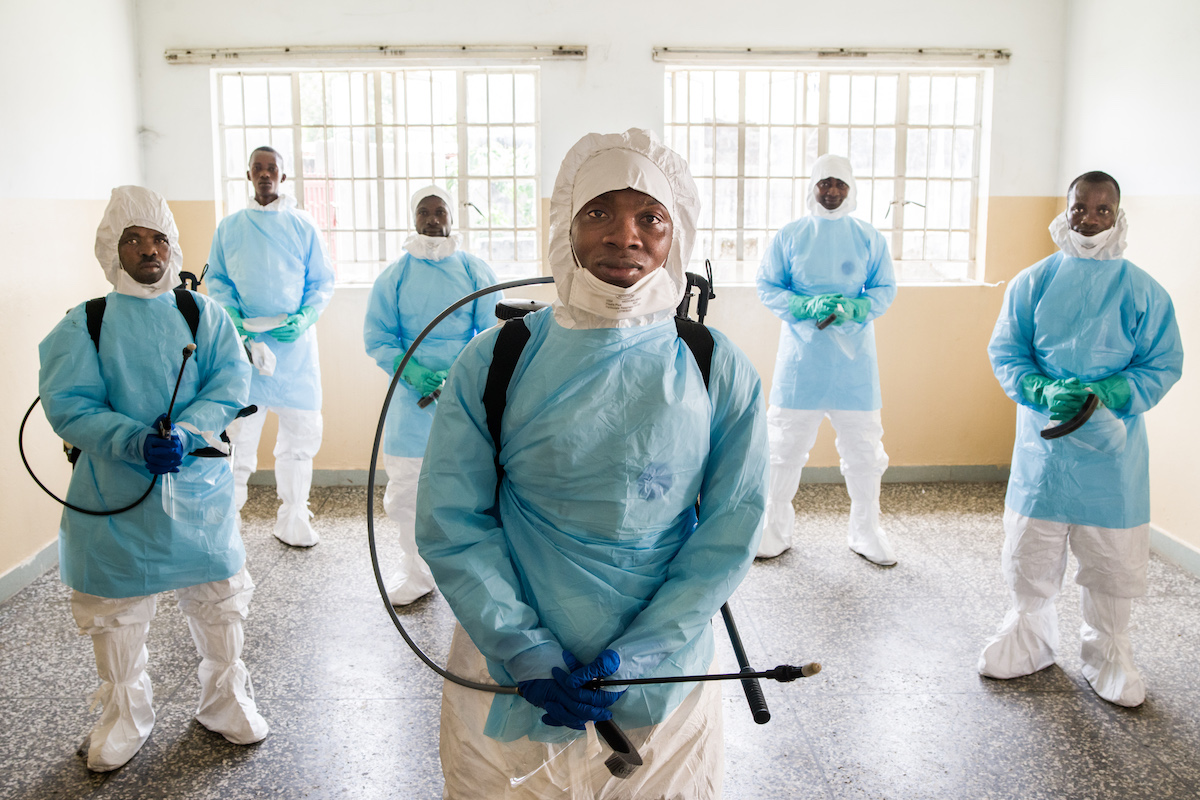 Patrick Bassie, 27, a member of burial Team 7, pictured with other team members at a children's hospital in Freetown, Sierra Leone, during the Ebola outbreak in 2015.