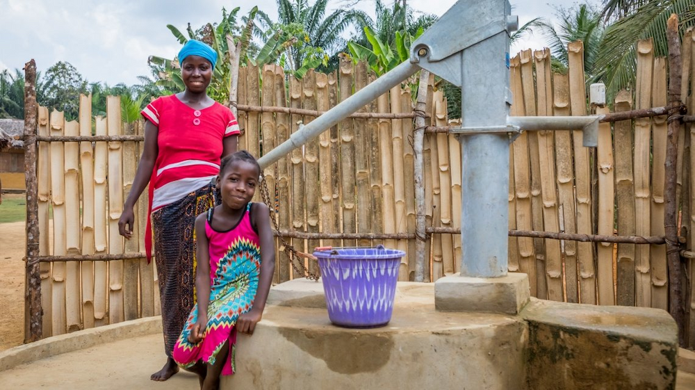 Irene with her daughter Lucy and their new water pump
