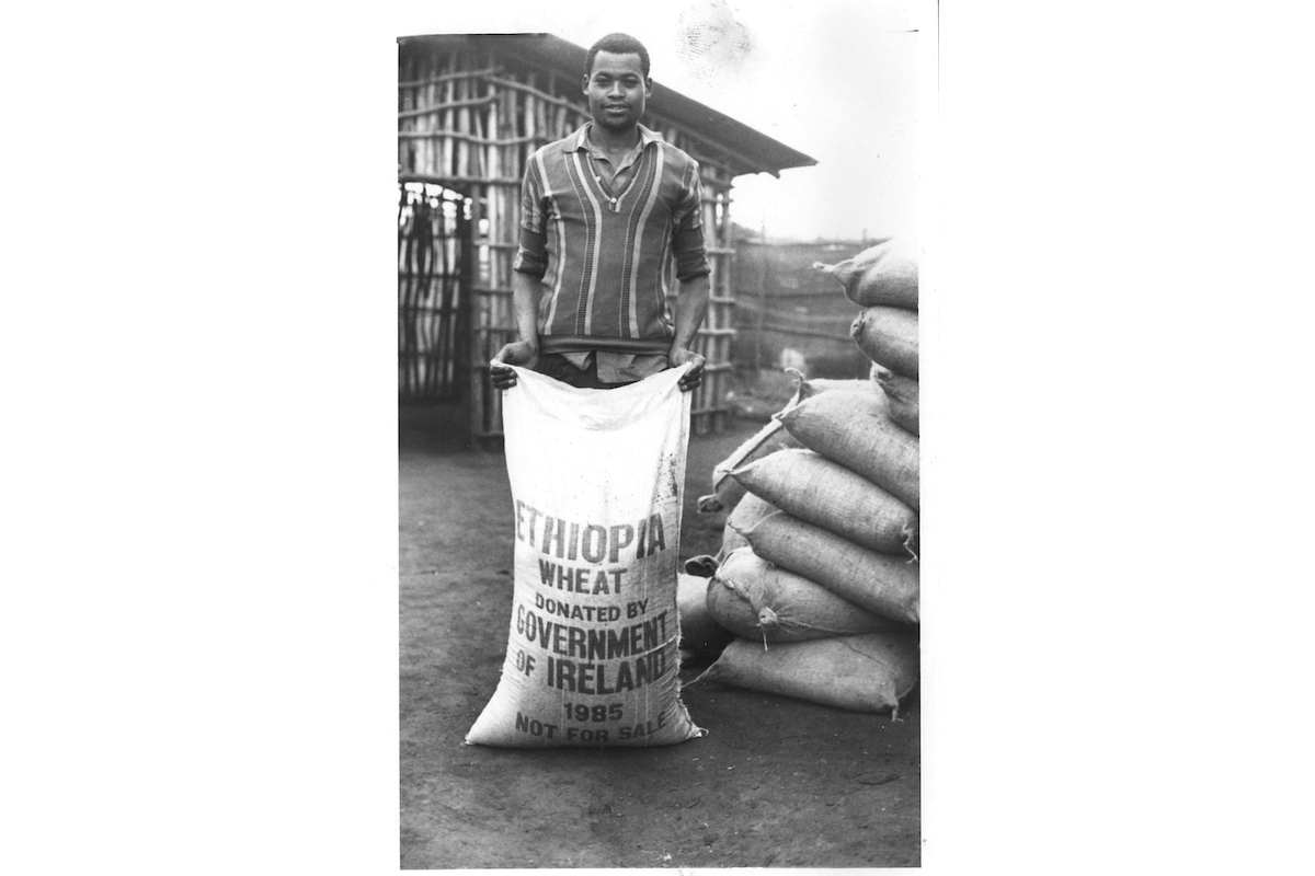 A man holds a bag of wheat shipped from Ireland to Ethiopia during the 1984-85 famine. (Photo: Concern Worldwide)