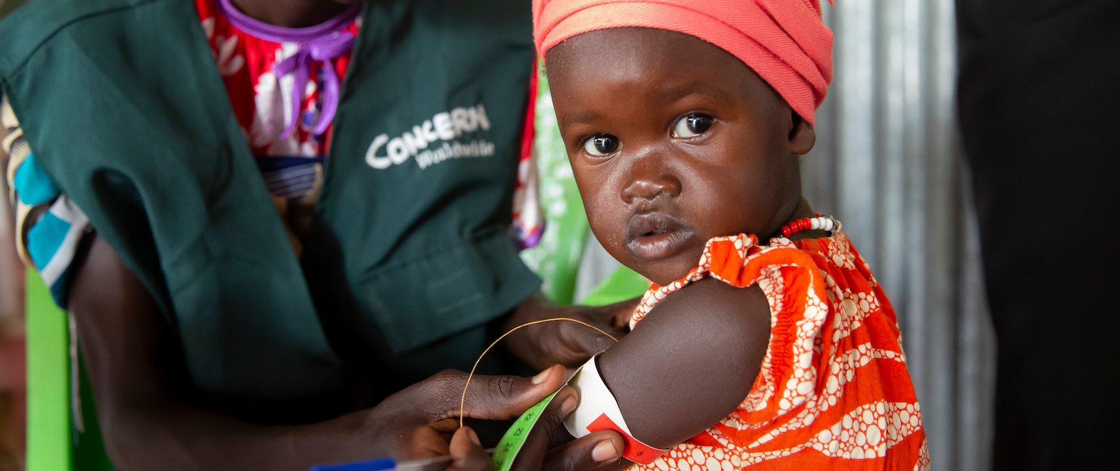 Baby Nya has her MUAC measured by Nya Guon Chuol Riek, a Community Outreach Mobilizer with Concern Worldwide, at Old Nuer nutrition site in Gambella, Ethiopia
