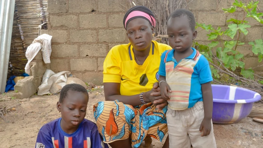 Sylvie Adama Oubda, an internally displaced person, with two of her children, Larissa and Jean-Baptiste, in Pouytenga, Burkina Faso. (Photo: Jean-Paul Ouedraogo/Concern Worldwide)