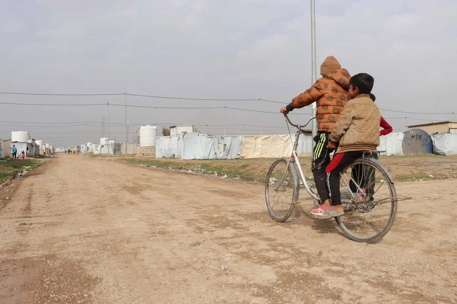 Refugee children on a bicycle