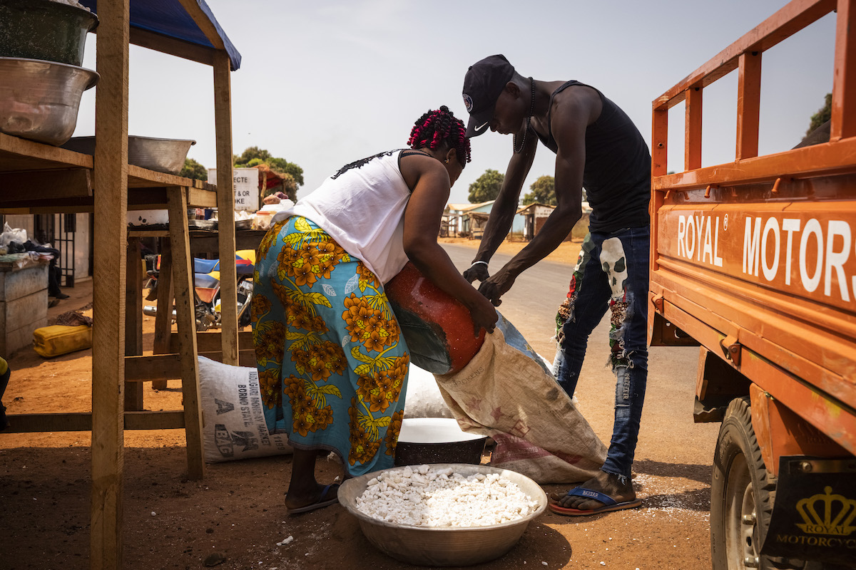Elvire Doungoule, 33 sells dried kassava at the stand she co-owns in Yaloké.  (Photo: Ed Ram/Concern Worldwide)