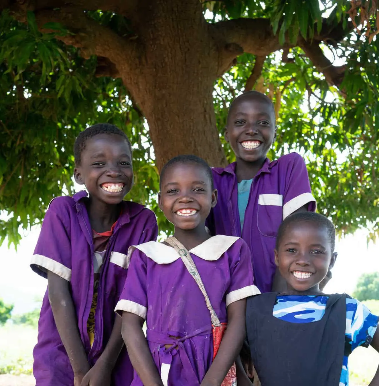 Yohane, 13, Yesaya, 10, Salayi, 8 and Luth, 6 in their school uniforms that their parents could afford with the money they received from Concern Worldwide, Manjolo Village, Nsanje District.