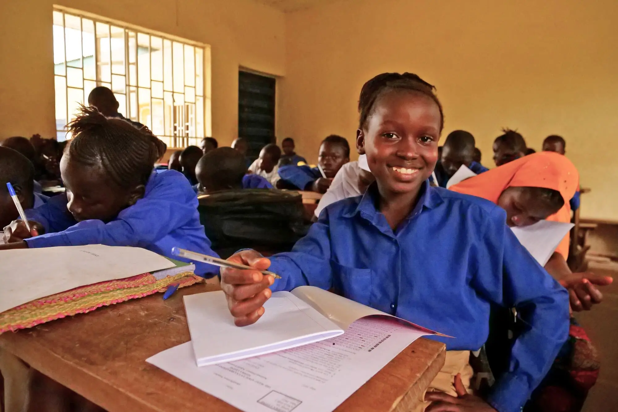 Mariatu Conteh (10) during a Class 6 lesson at the Muslim Brotherhood School in Masakong.