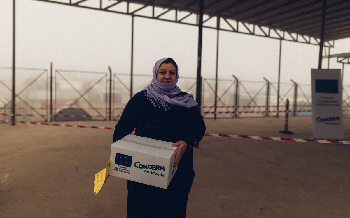 Aziza (36) is from Sinjar Sinuneh. "We are a family of 5. I still haven’t opened the box yet. it is a hygiene kit that has shampoo, soap, and nappies. I don’t have any children that needs a nappy so I will give them to my neighbour. This is the only NGO that distributes the hygiene kit. We have been in the camps for 4 years, life is very hard in the camps, things get dirty quickly, the project inside the camp is making it even worse, so hygiene kits are crucial for us." (Photo: George Henton/Concern Worldwide) A Concern distribution at Bardarash site, Iraq. (Photo: Concern Worldwide) A Concern distribution at Bardarash site, Iraq. (Photo: Concern Worldwide) People receive hygiene kits at Khanke IDP site in Duhok. The kits contain shampoo, soap, detergent, nappies and pads for women. (Photo: George Henton/Concern Worldwide) People receive hygiene kits at Khanke IDP site in Duhok in Iraq. Photo: George Henton / Concern Worldwide. Markaz (40) from Sinjar Til Qasab. "I live here with my family; we are a family of 9, I have 7 children we all live in one tent which is very small. They inform us about aid distributions, and we go to receive them, I don’t believe they are very useful, I don’t know what is in this box. They don’t give us enough aid; my husband needs a surgery no NGO is helping us to treat him not even the camp administrations. Since the winter came, we haven’t had any oil for the heaters, my son doesn’t leave his bed in th Markaz (40) from Sinjar Til Qasab. "I live here with my family; we are a family of 9, I have 7 children we all live in one tent which is very small. They inform us about aid distributions, and we go to receive them, I don’t believe they are very useful, I don’t know what is in this box. They don’t give us enough aid; my husband needs a surgery no NGO is helping us to treat him not even the camp administrations. Since the winter came, we haven’t had any oil for the heaters, my son doesn’t leave his bed in the m