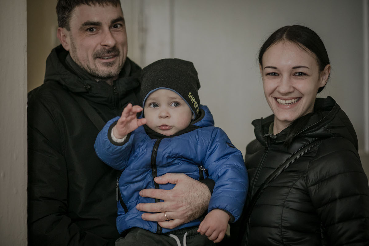 Halya*, Dovud* and their son, Matviy* received a food kit from Concern at a local hub. (Photo: Simona Supino/Concern Worldwide)