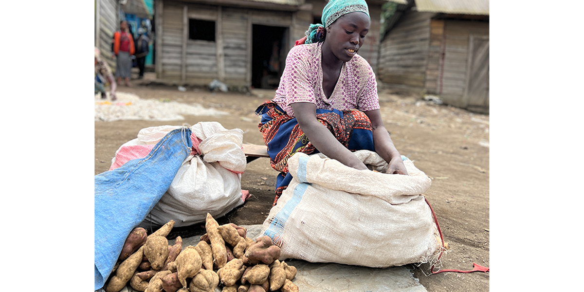 After participating in a Concern training on income-generating activities and receiving cash assistance, Furaha now has a prosperous business in wholesale and retail where she sells potatoes in her village market in Ndobogo, DRC. (Photo: Ariane Rwankuba/Concern Worldwide)