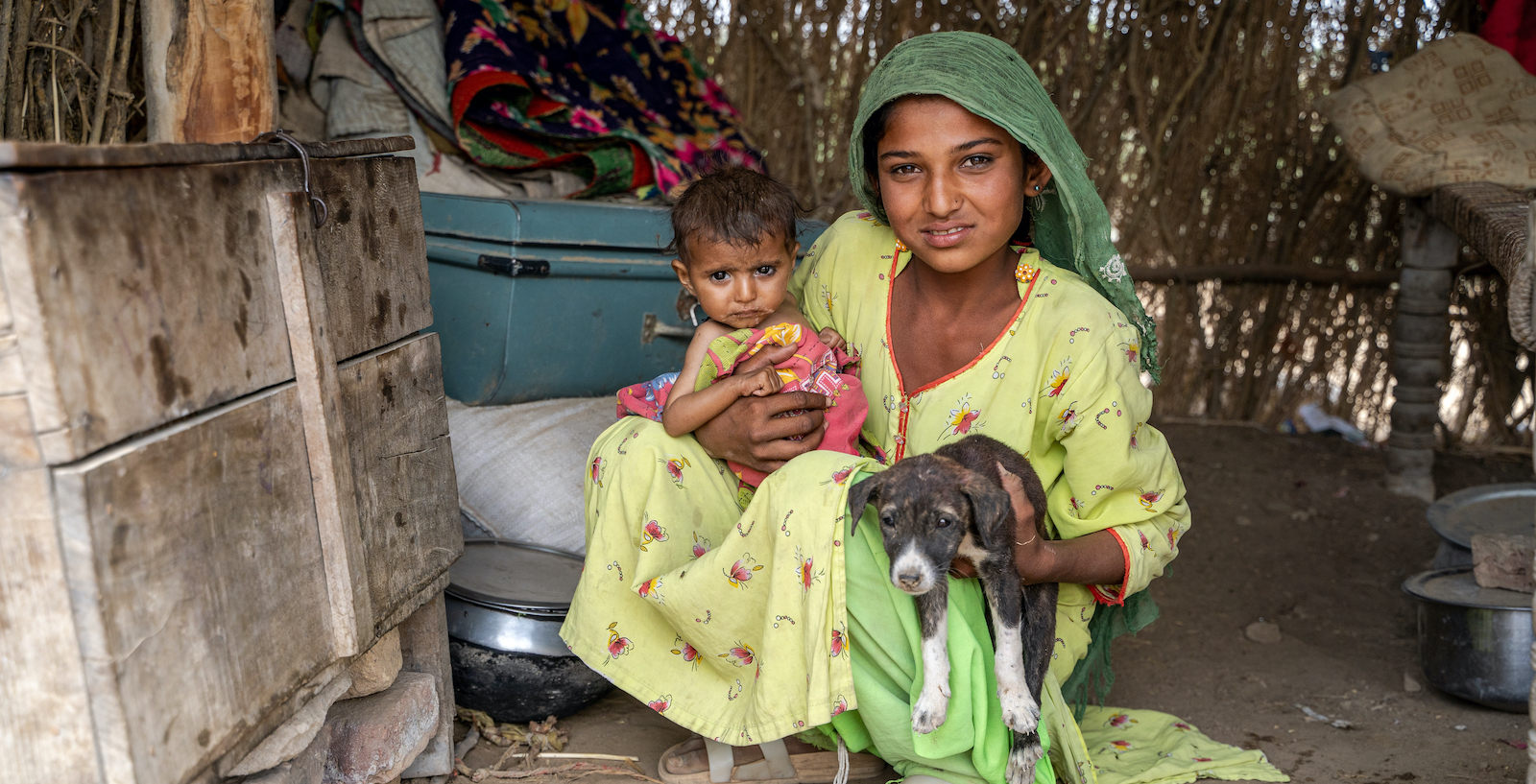 Big sister Samina holding little Shanti outside their home in Umerkot, Sindh. Photo: Arif Shad/Ingenious Captures/Concern Worldwide