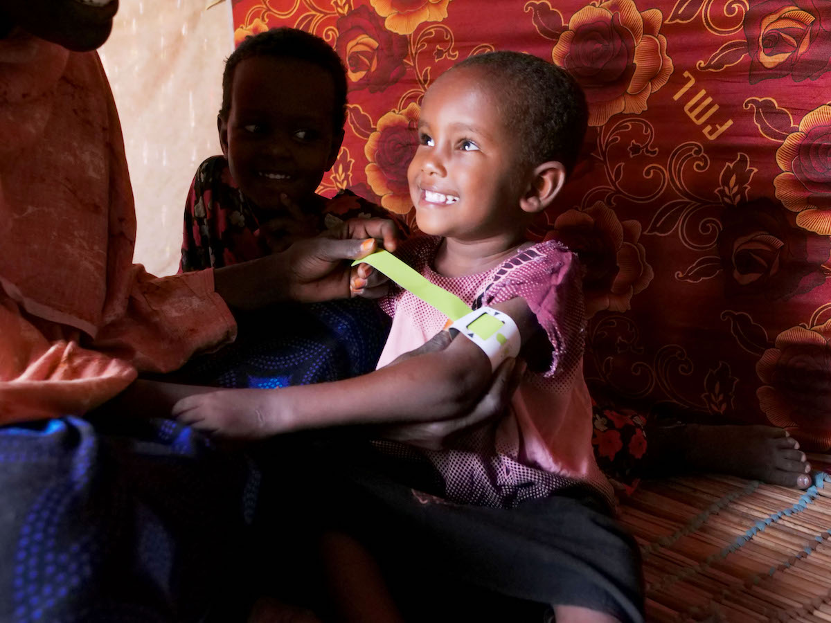 Mother of four Halima Bare measures her four year old Iqra Hassan's mid upper arm circumference (MUAC). (Photo: Eugene Ikua/Concern Worldwide)