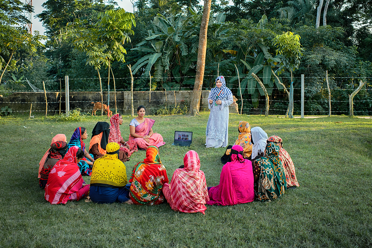 Youth leader Sumaiya Akter Jui holds a meeting with female villagers about water purification as part of the Concern-led CRAAIN program in Bangladesh. (Photo: Mohammad Rakibul Hasan/Concern Worldwide)