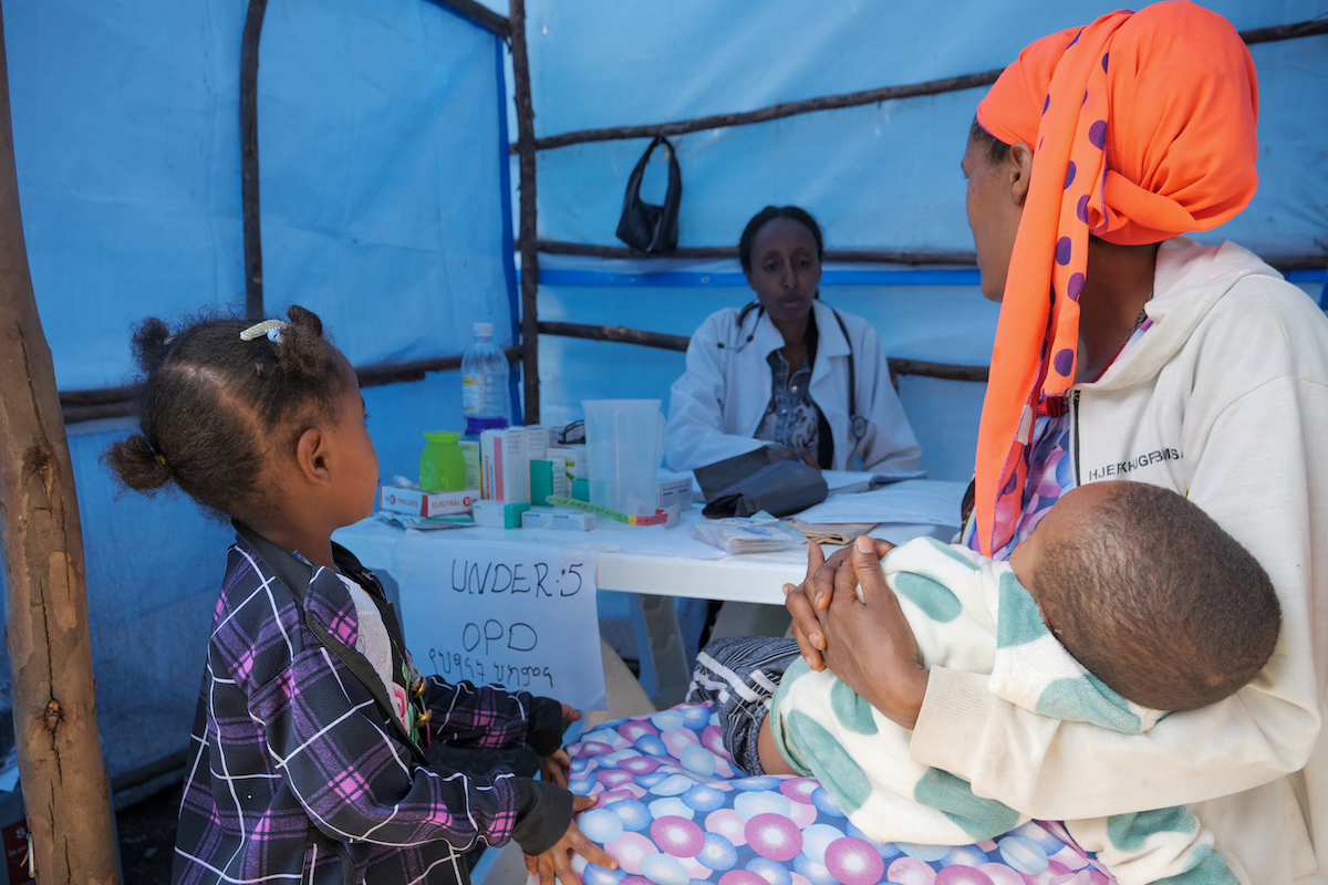 Mother of two Martha Tesfaye speaks to Amint Mohammed Yesuf at a Concern-run mobile health clinic in Amhara, Ethiopia. (Photo: Eugene Ikua/Concern Worldwide)