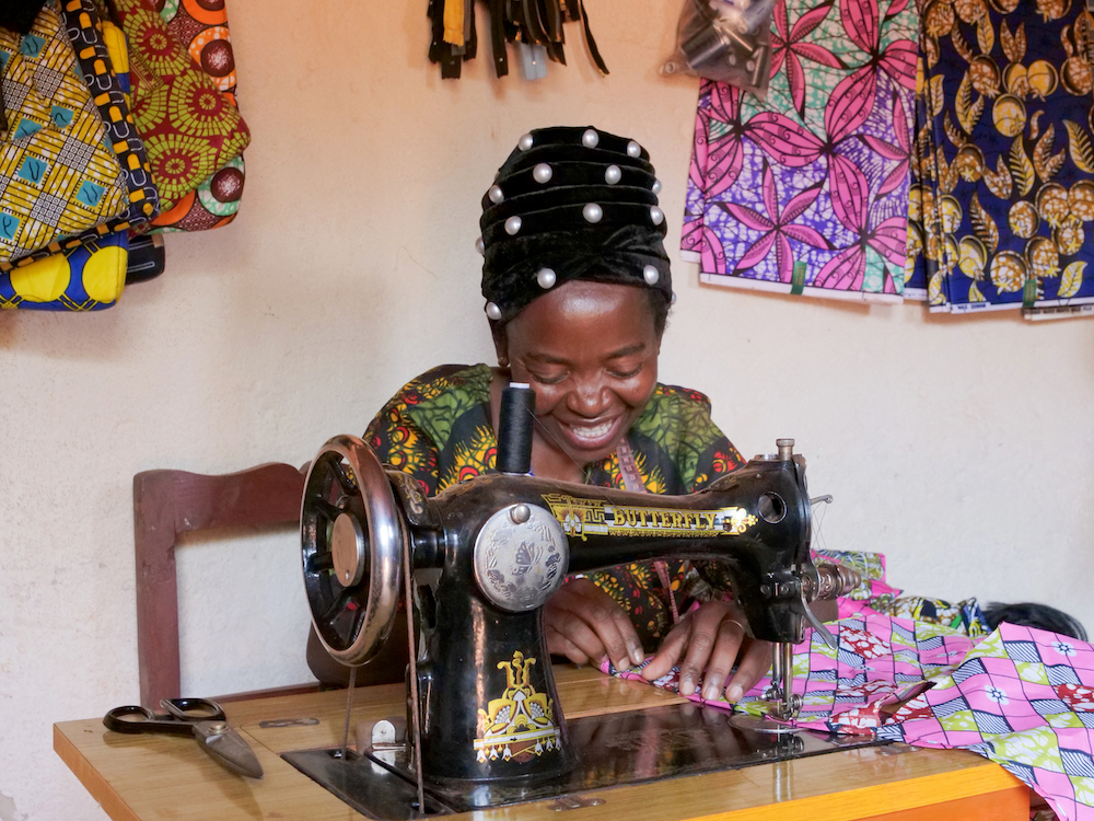 Alexia Mukashyaka (40) at her tailoring shop in Mugombwa, Gisagara. (Photos: Eugene Ikua / Concern Worldwide)