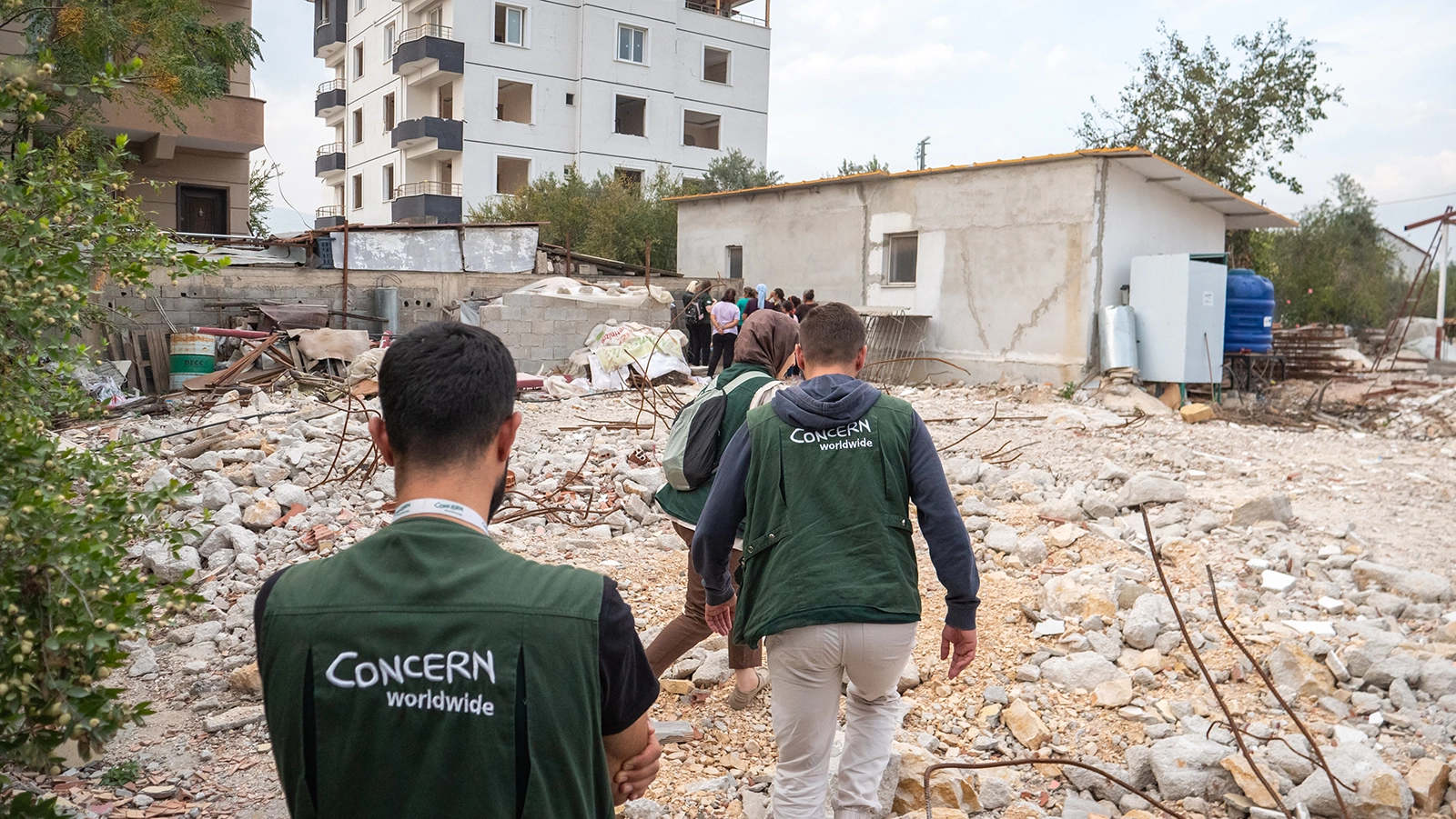 Concern staff inspect the demolition and removal of unsafe buildings in a community In Hatay. (Photo: Gavin Douglas/Concern Worldwide)