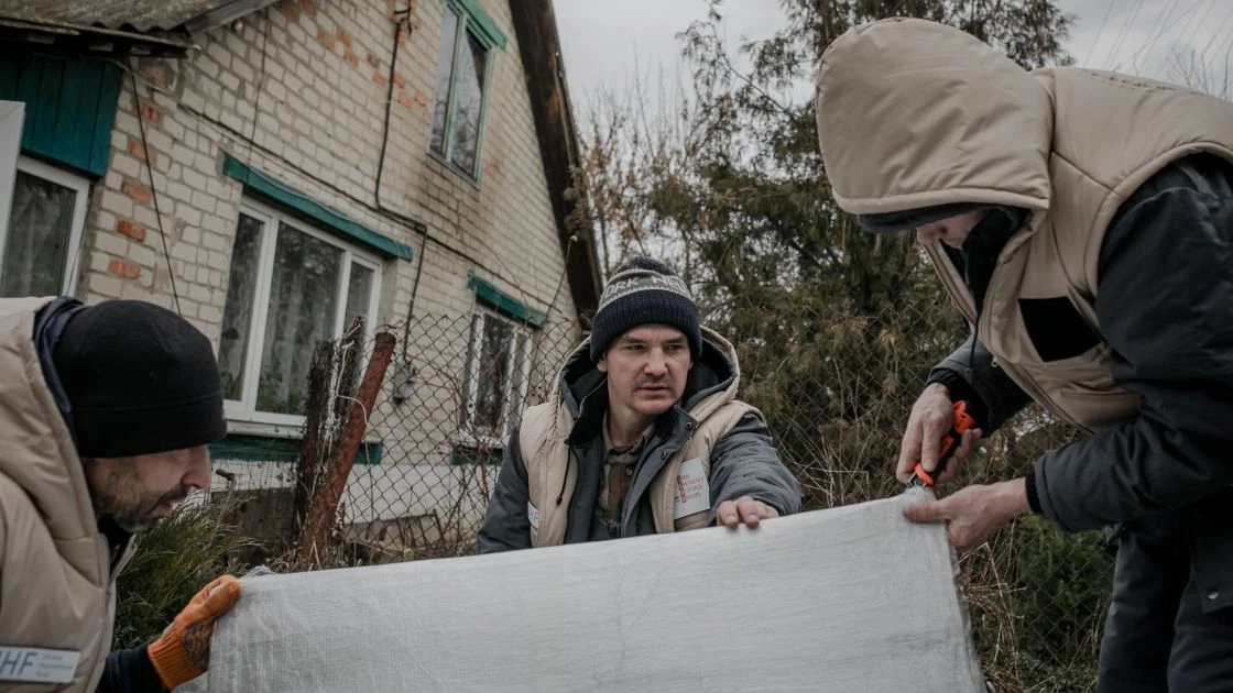 Volunteers with Concern's partner We are Brothers are preparing to install stoves and insulation in households in Hontarivka village, Ukraine. (Photo: Simona Supino/Concern Worldwide)