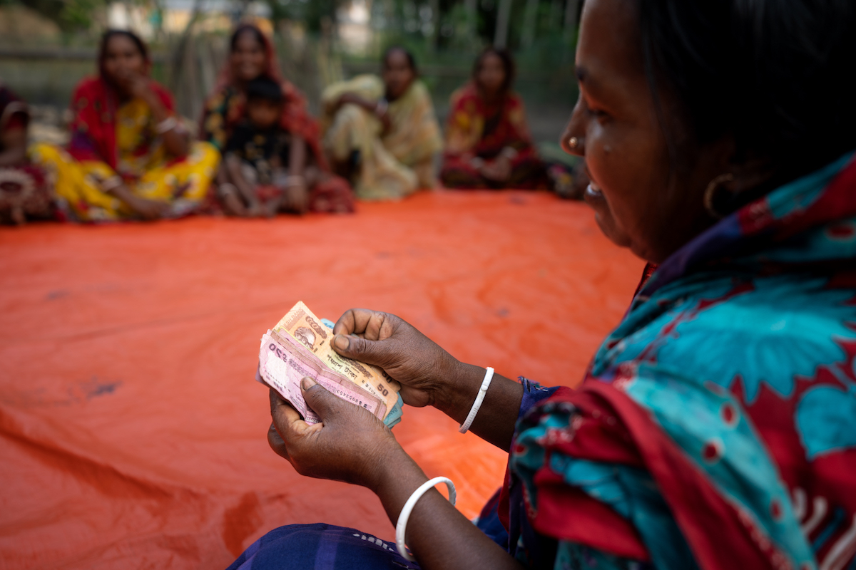 A member of the Concern Bangladesh program, Enhancing Resilience of Coastal Communities (ERCC), receives a grant to invest in her agriculture business. (Photo: Mumit M/Concern Worldwide)