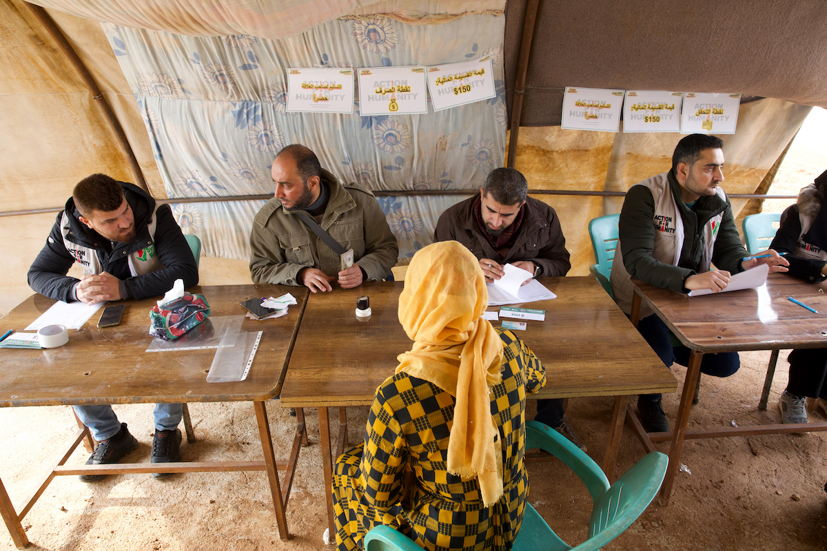 Members of the Syria Relief team deliver cash vouchers to people affected by the February 2023 earthquake in December, 2023. (Photo: Ali Haj Suleiman/DEC/Fairpicture)