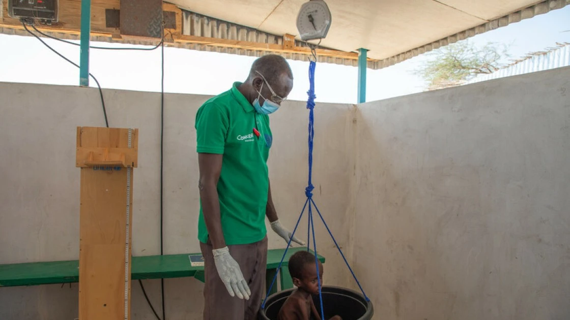 A child is weighed at the Concern health post in Baga Sola, Western Chad. Photo: Eugene Ikua/Concern Worldwide