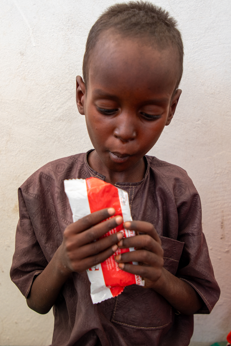 Abdul Alhadji (age 5), eats a course of Plumpy'Nut at home in Lac Province, Chad. Photo: Eugene Ikua/Concern Worldwide