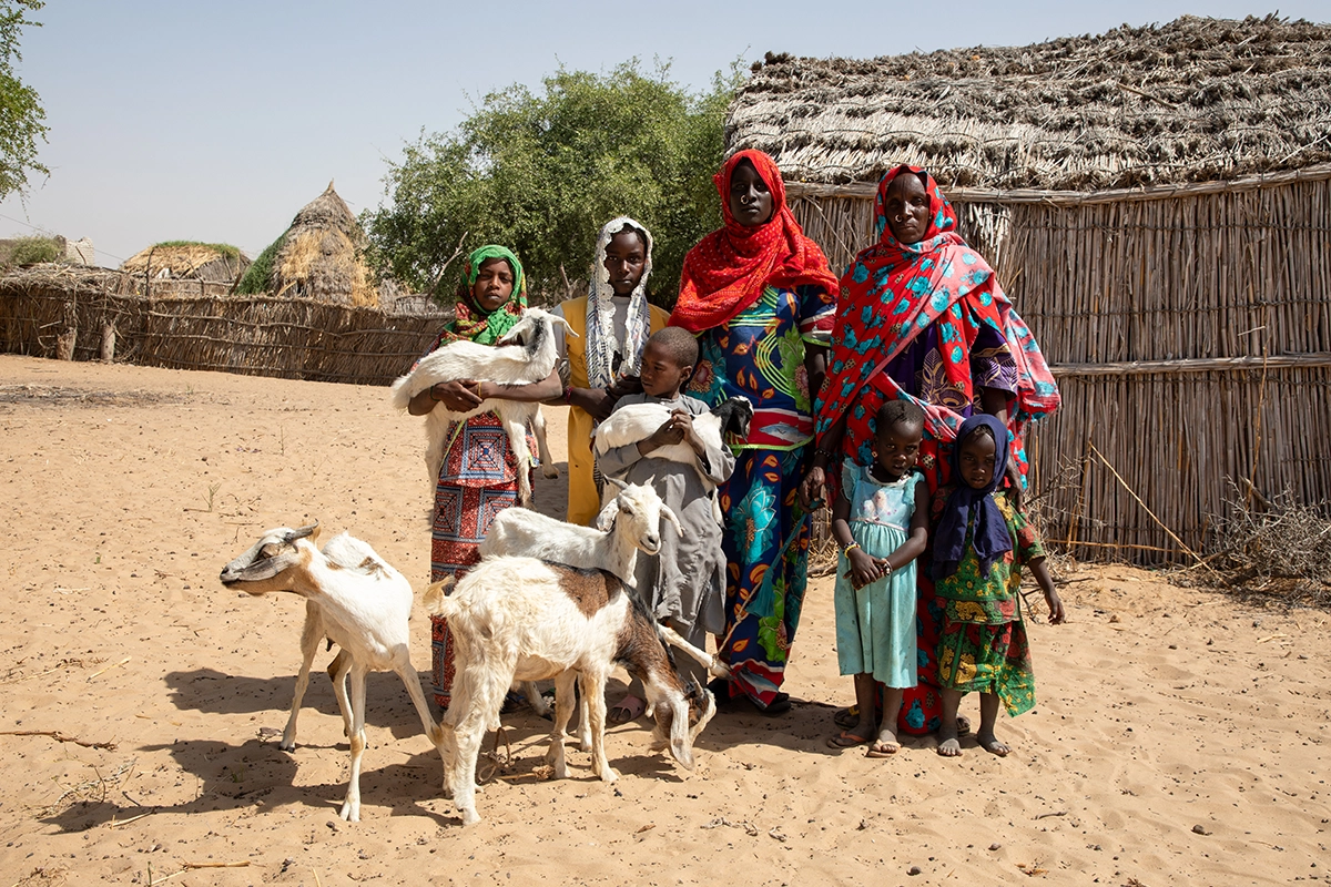 Salmata with her children and their family's latest addition: a small herd of goats, delivered as part of Concern's Chronic Humanitarian Crisis program. (Photo: Eugene Ikua/Concern Worldwide)