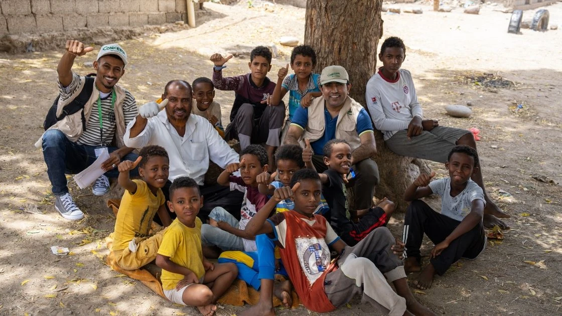 Abdul Ghaffar, Concern Program Director and Health facility Manager with children of a small village in Tuban district, Lahj Governorate where Concern is providing health and nutrition services. (Photo: Aamar Khalaf/Concern Worldwide)